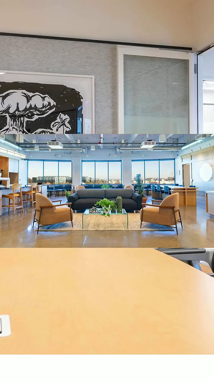 expansive san mateo lounge area with large wall art, seating, and floor-to-ceiling windows overlooking san mateo
